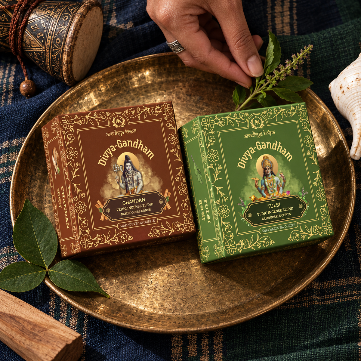 Two boxed sets of Divyagandham bambooless dhoop cones featuring Chandan (Sandalwood) for Lord Shiva puja and Tulsi (Holy Basil) for Lord Vishnu worship, displayed on a Plate.
