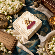 Overhead view of the Divyagandham Chameli bambooless incense cones box featuring Maa Saraswati, surrounded by jasmine flowers, a brass diya, and a Sanskrit text.