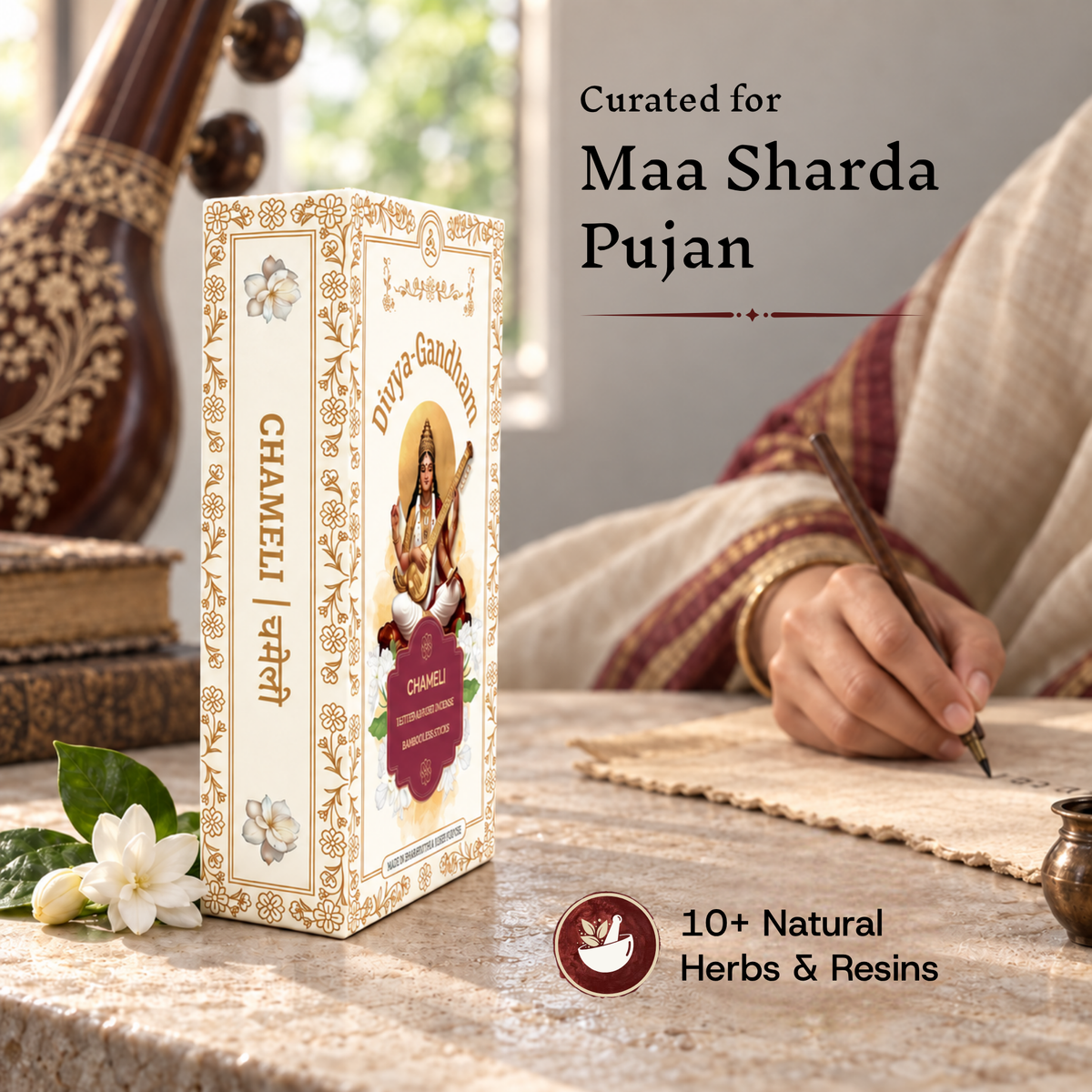Divyagandham Chameli incense box curated for Maa Sharda Pujan containing 10+ natural herbs and resins, shown as someone writes on paper in the background.