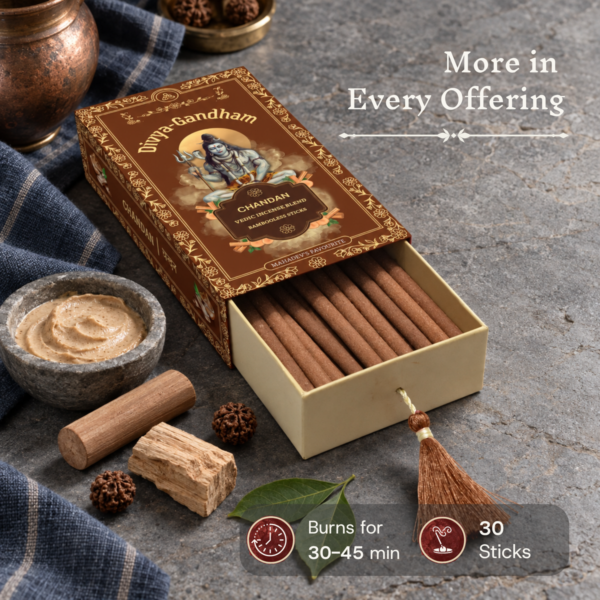 Open Divyagandham Chandan incense sticks box detailing a 30-stick count and a 30 to 45-minute burn time alongside sandalwood logs, rudraksha beads, and a bowl of fresh sandalwood paste.