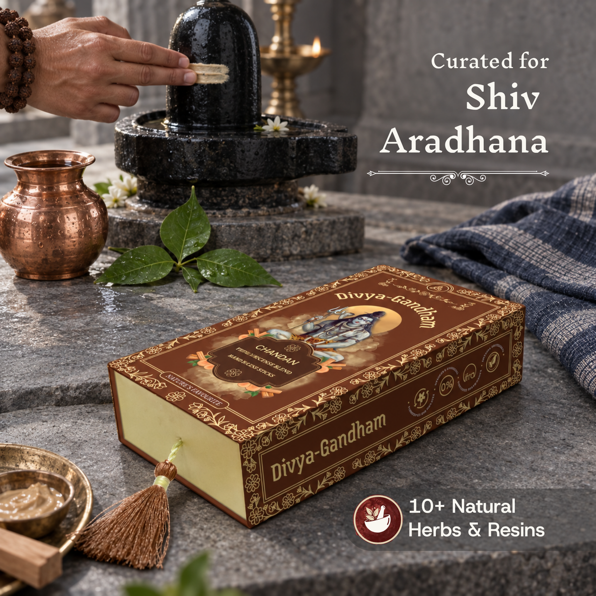 Divyagandham Chandan incense box curated for Shiv Aradhana containing 10+ natural herbs and resins, positioned near a person applying sandalwood paste to a Shivling alongside fresh bel leaves.