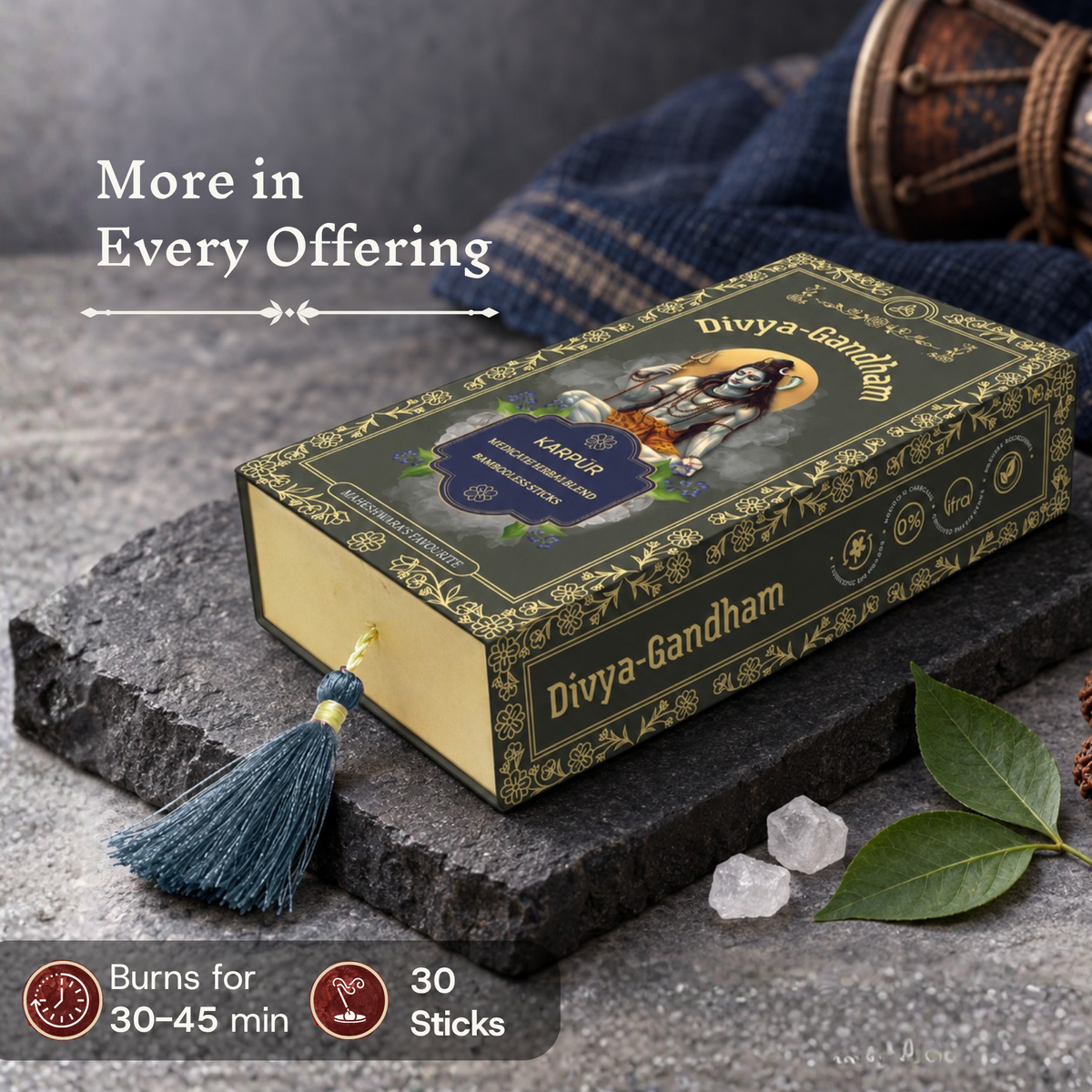 Divyagandham Karpur incense sticks box detailing a 30-stick count and a 30 to 45-minute burn time near a traditional damaru and camphor crystals on a dark stone slab.