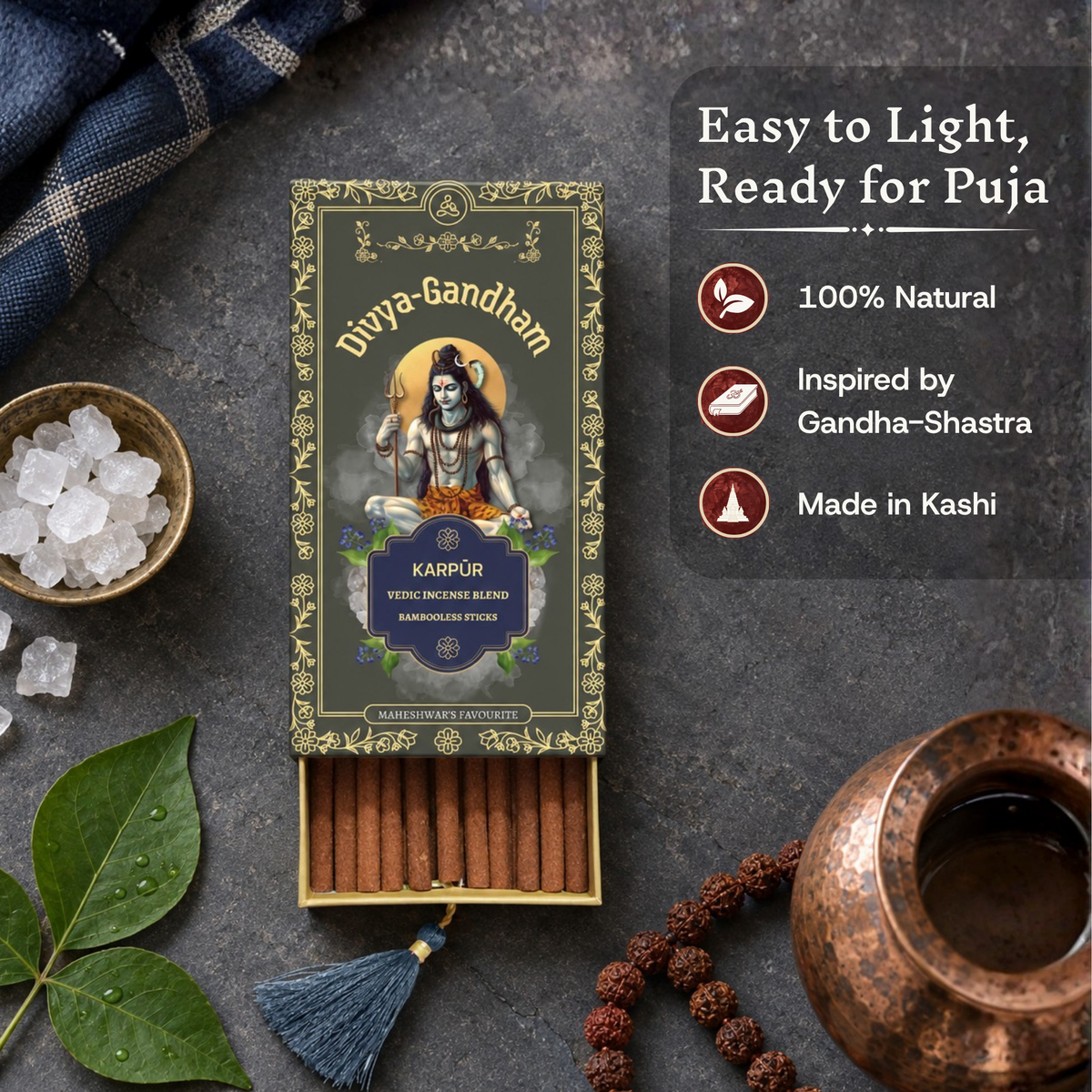 Open Divyagandham Karpur incense sticks box highlighting it is easy to light, 100% natural, and inspired by Gandha-Shastra, accompanied by camphor crystals and a copper kalash.