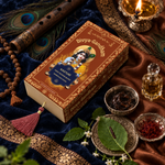 Overhead view of the Divyagandham Kasturi bambooless incense sticks box featuring Lord Krishna, surrounded by a wooden flute, peacock feather, tulsi mala, and saffron.