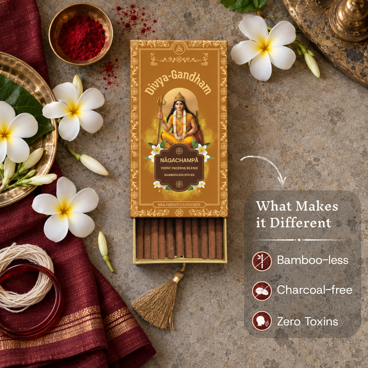 Open Divyagandham Nagachampa incense box highlighting its key differentiators: bamboo-less, charcoal-free, and zero toxins, placed near kumkum and white plumeria flowers.