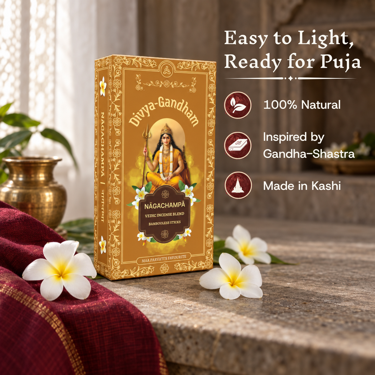 Divyagandham Nagachampa incense box standing upright, highlighting that it is easy to light, 100% natural, inspired by Gandha-Shastra, and made in Kashi, with white flowers nearby.