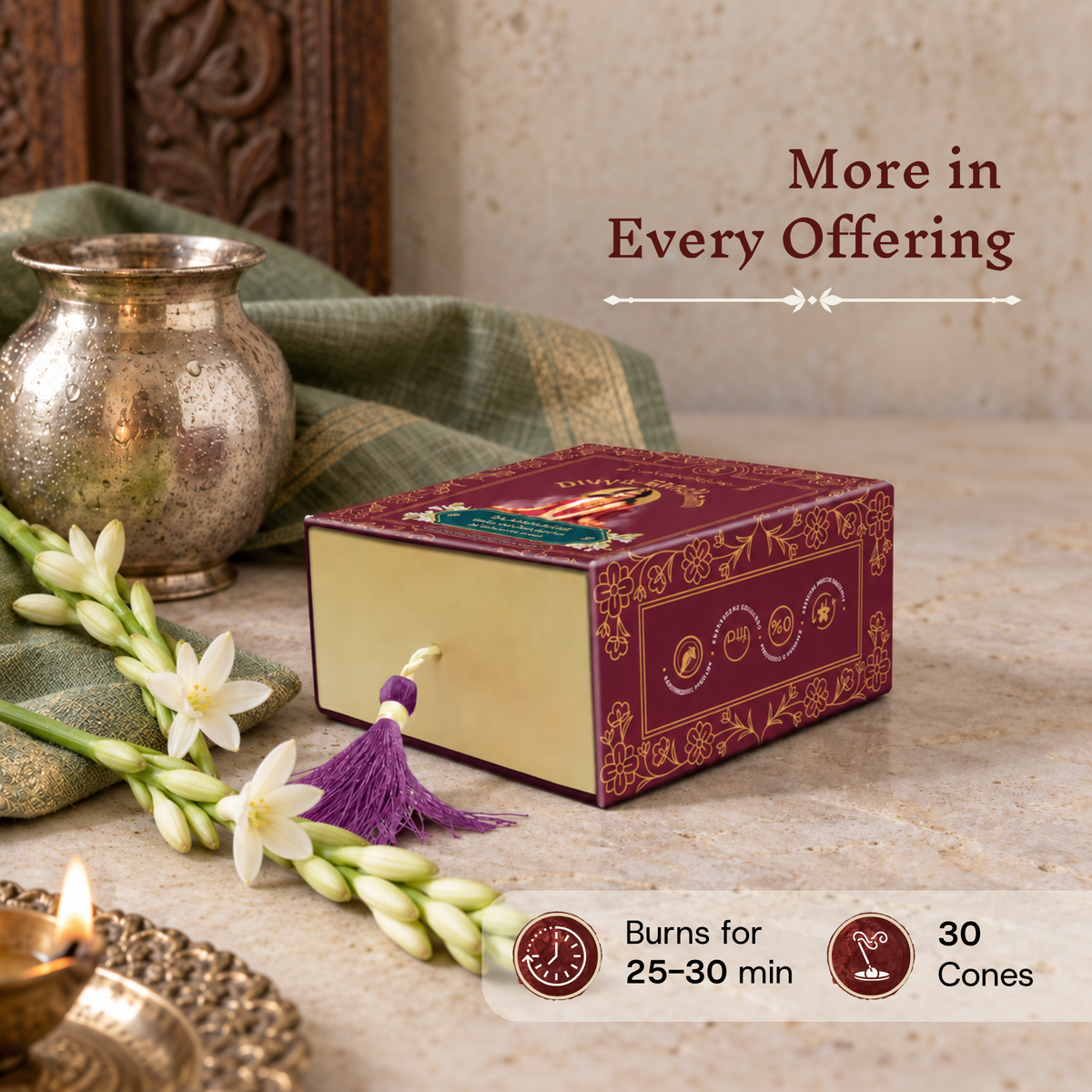Divyagandham Rajanigandha incense cones box detailing a 30-cone count and a 25 to 30-minute burn time alongside fresh tuberose flowers, a lit diya, and a metallic pot.