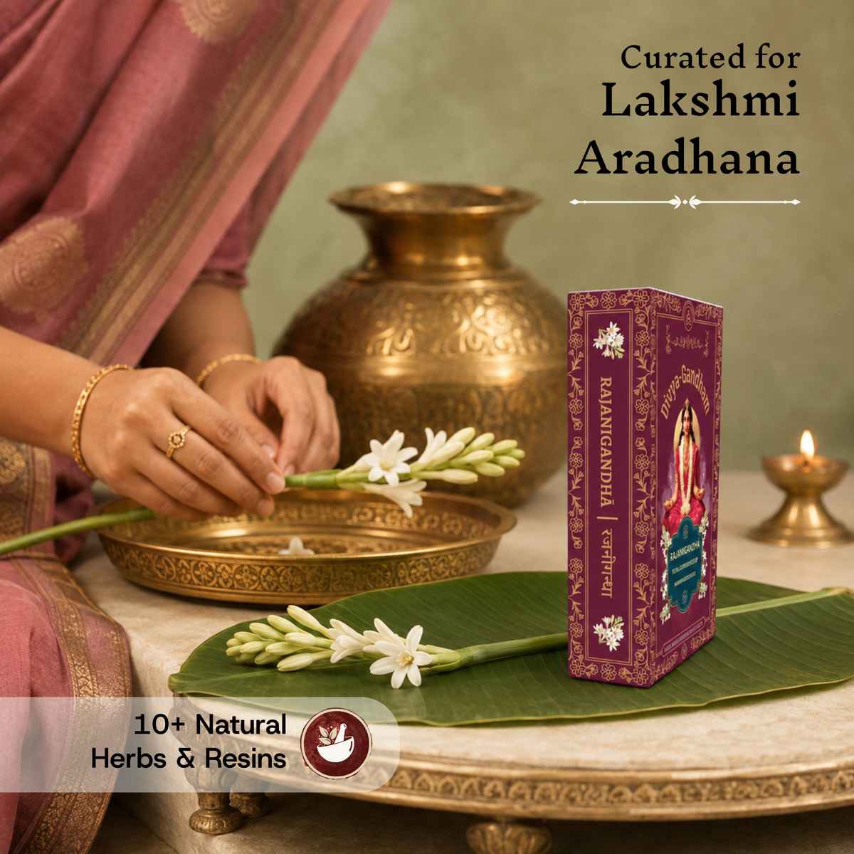 Divyagandham Rajanigandha incense sticks box curated for Lakshmi Aradhana containing 10+ natural herbs and resins, positioned near a woman's hands adjusting tuberose flowers on a brass tray.