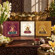 Three boxed sets of Divyagandham bambooless dhoop cones formulated for Devi worship, featuring Rajnigandha for Mata Mahalakshmi, Nagachampa for Maa Parvati, and Chameli arranged on a carved wooden table with brass lamps, flowers, and decorative props in a styled indoor setting.